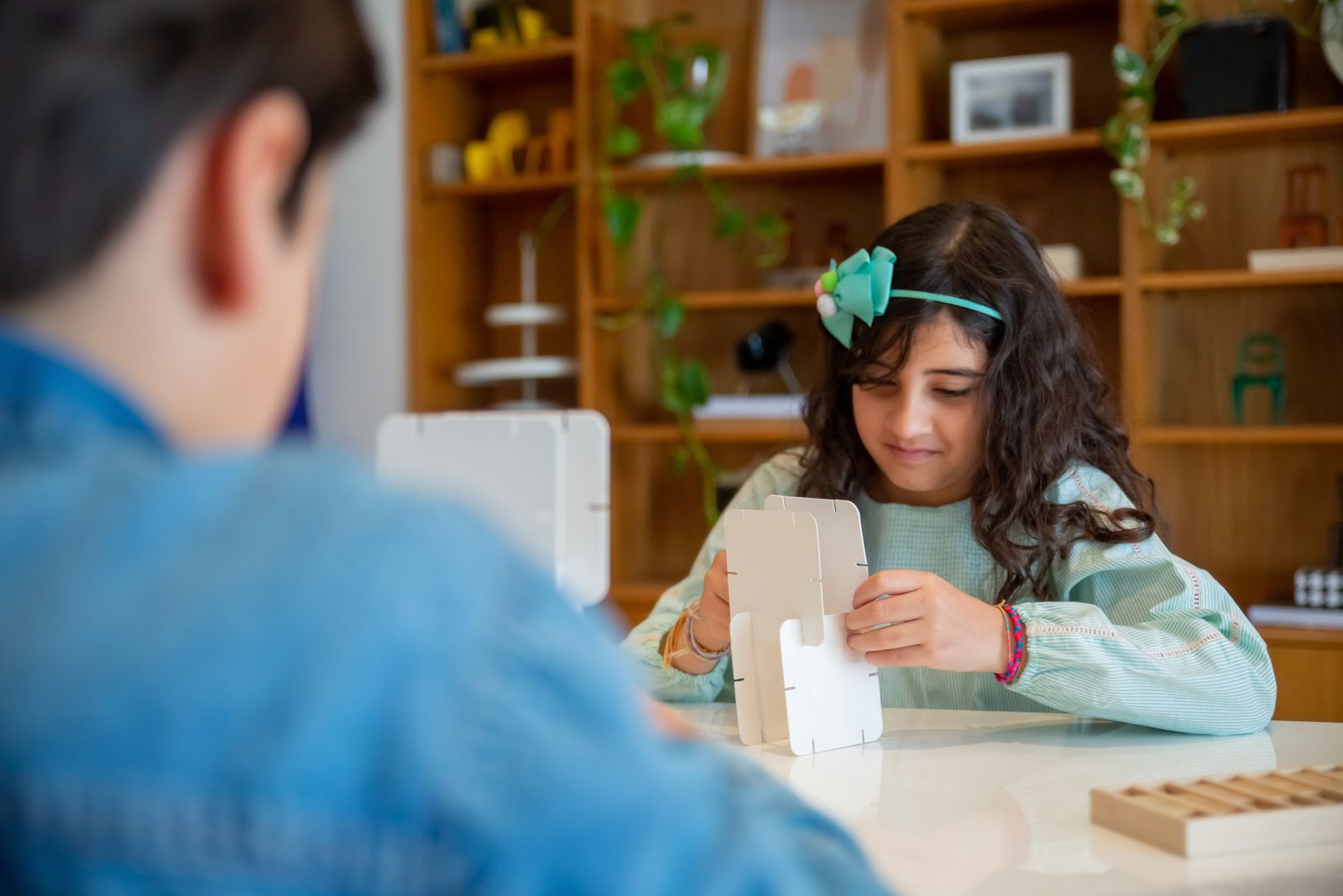 Children exploring a cardboard creation