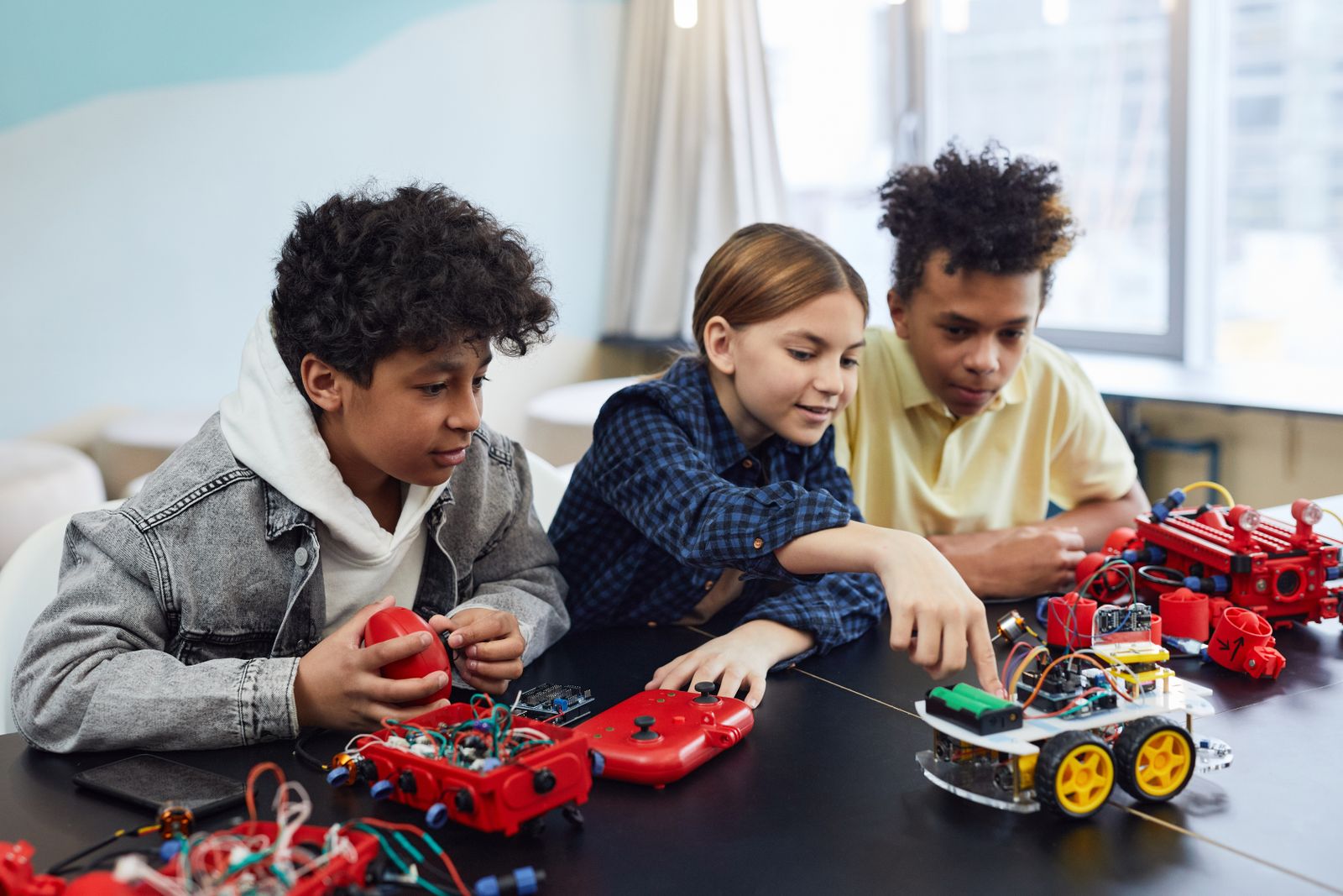 Children exploring electronics together